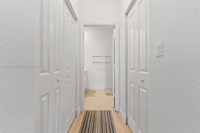 a bathroom with a glass door shower