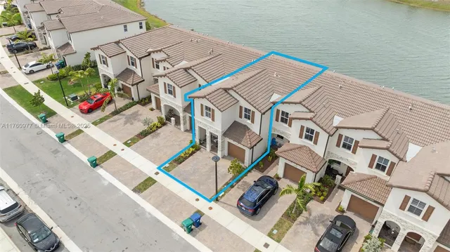an aerial view of residential houses with an outdoor space