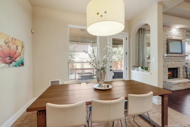 a dining room with furniture and window
