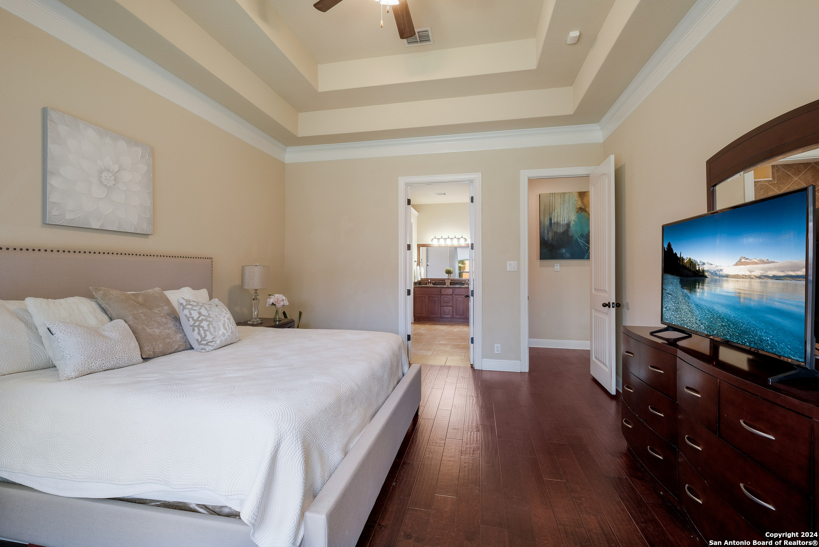 24503 Merlot Way San Antonio, TX 78260 - Photo 14 of 26 a bedroom with a bed and a flat screen tv