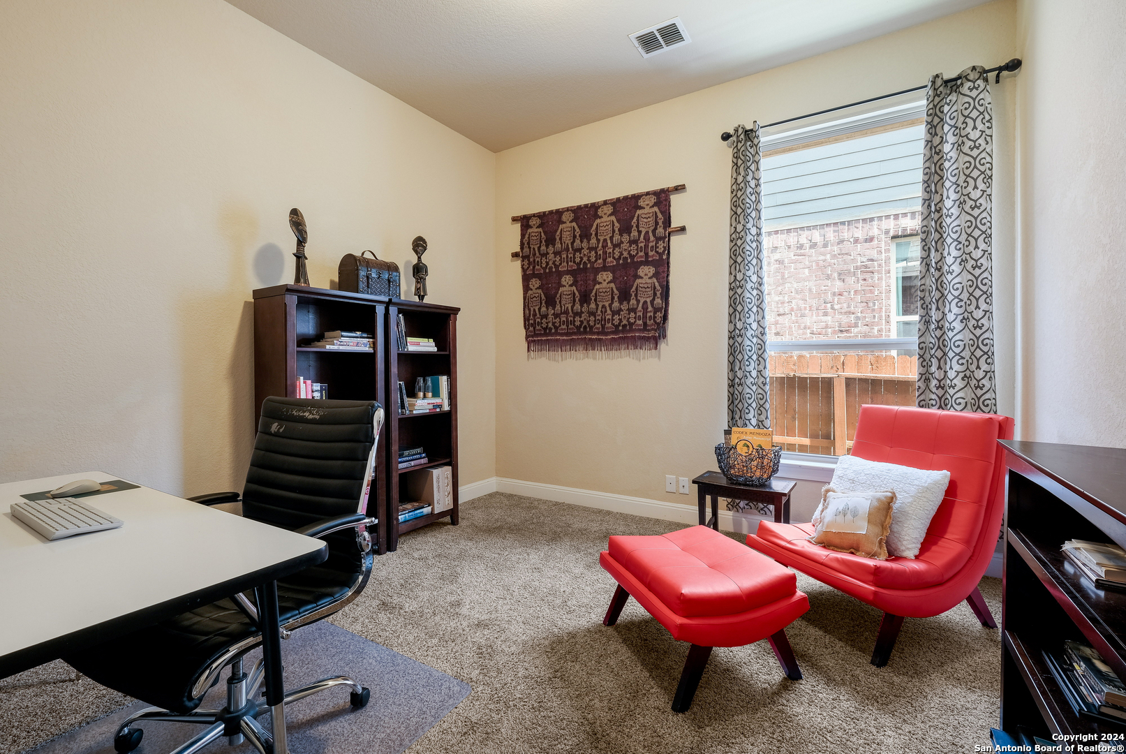 24503 Merlot Way San Antonio, TX 78260 - Photo 20 of 26 a living room with furniture and a book shelf