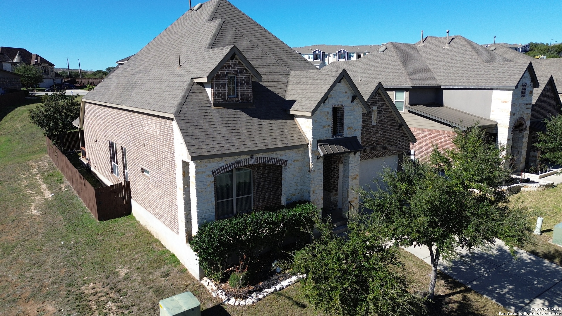 24503 Merlot Way San Antonio, TX 78260 - Photo 3 of 26 a aerial view of a house with a yard and potted plants