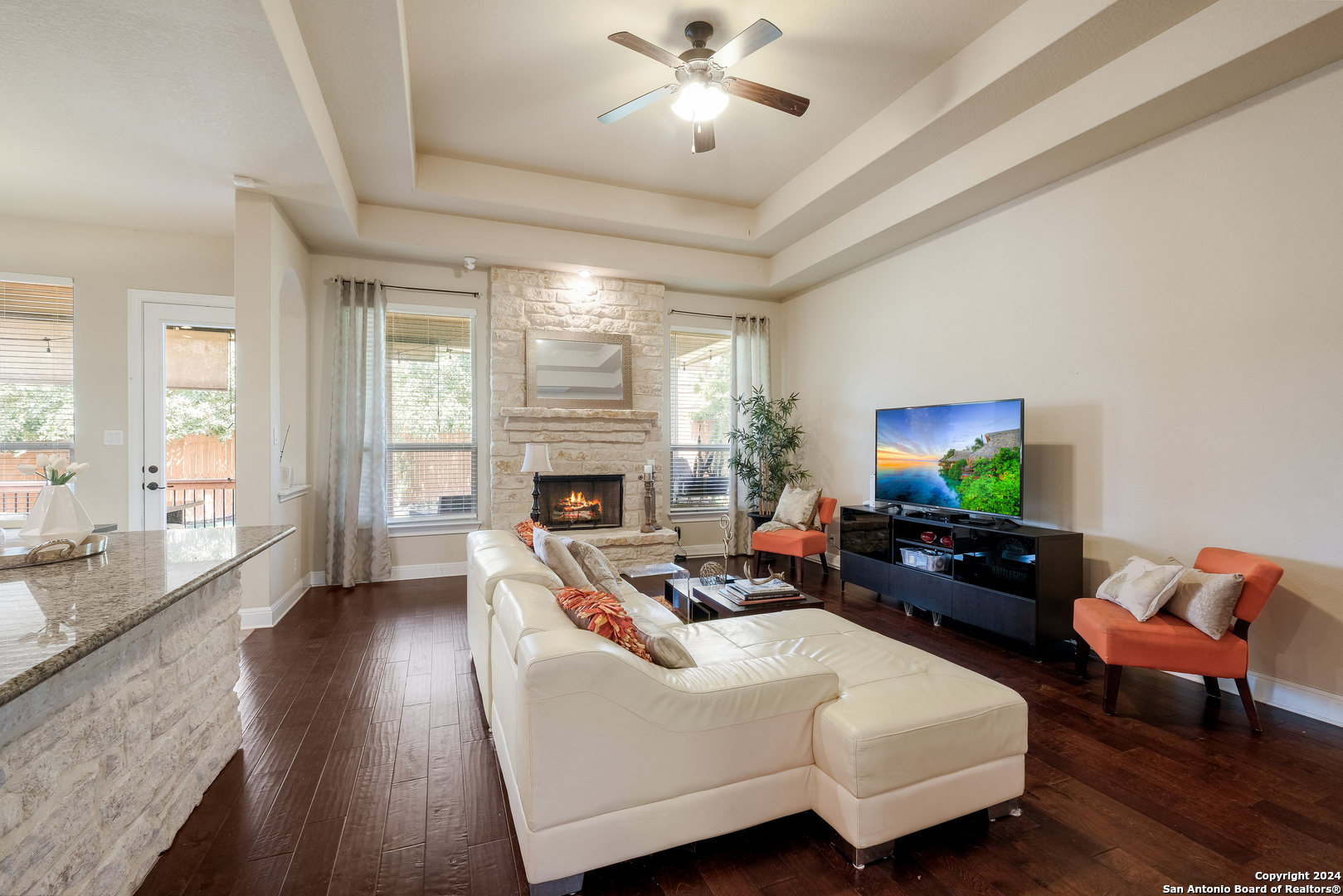 24503 Merlot Way San Antonio, TX 78260 - Photo 6 of 26 a living room with furniture and a fireplace