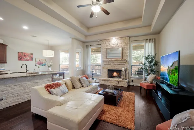 a living room with furniture and a fireplace