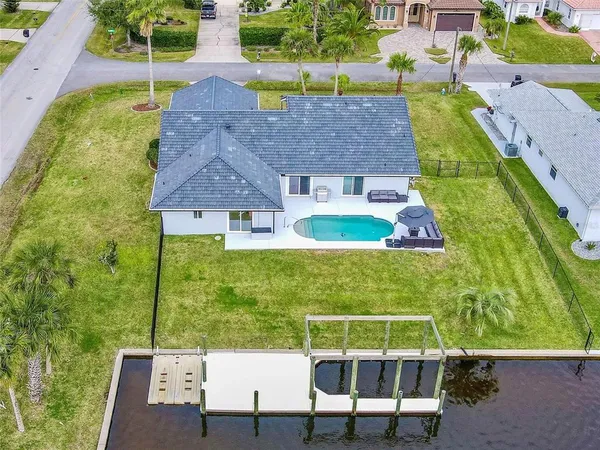 a aerial view of a house with a yard
