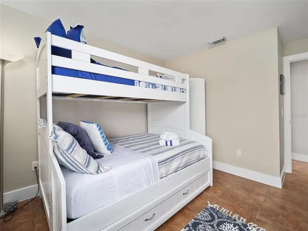 a bathroom with a granite countertop sink a toilet and a mirror