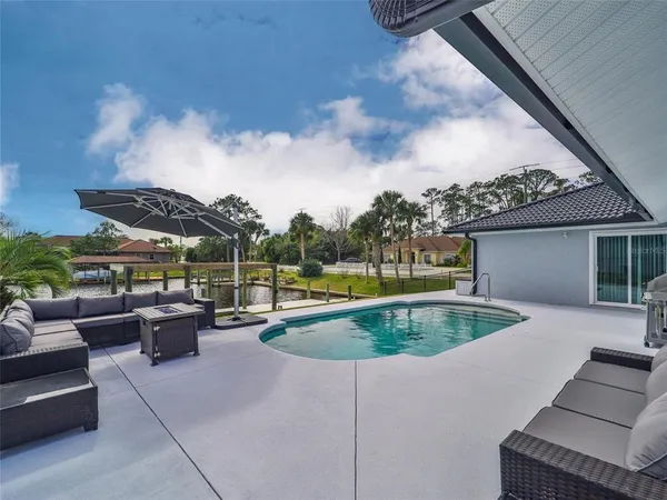 a view of a swimming pool with a patio