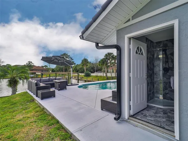 an aerial view of a house with a garden