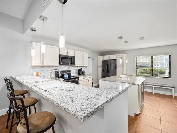 a kitchen with a sink and stove