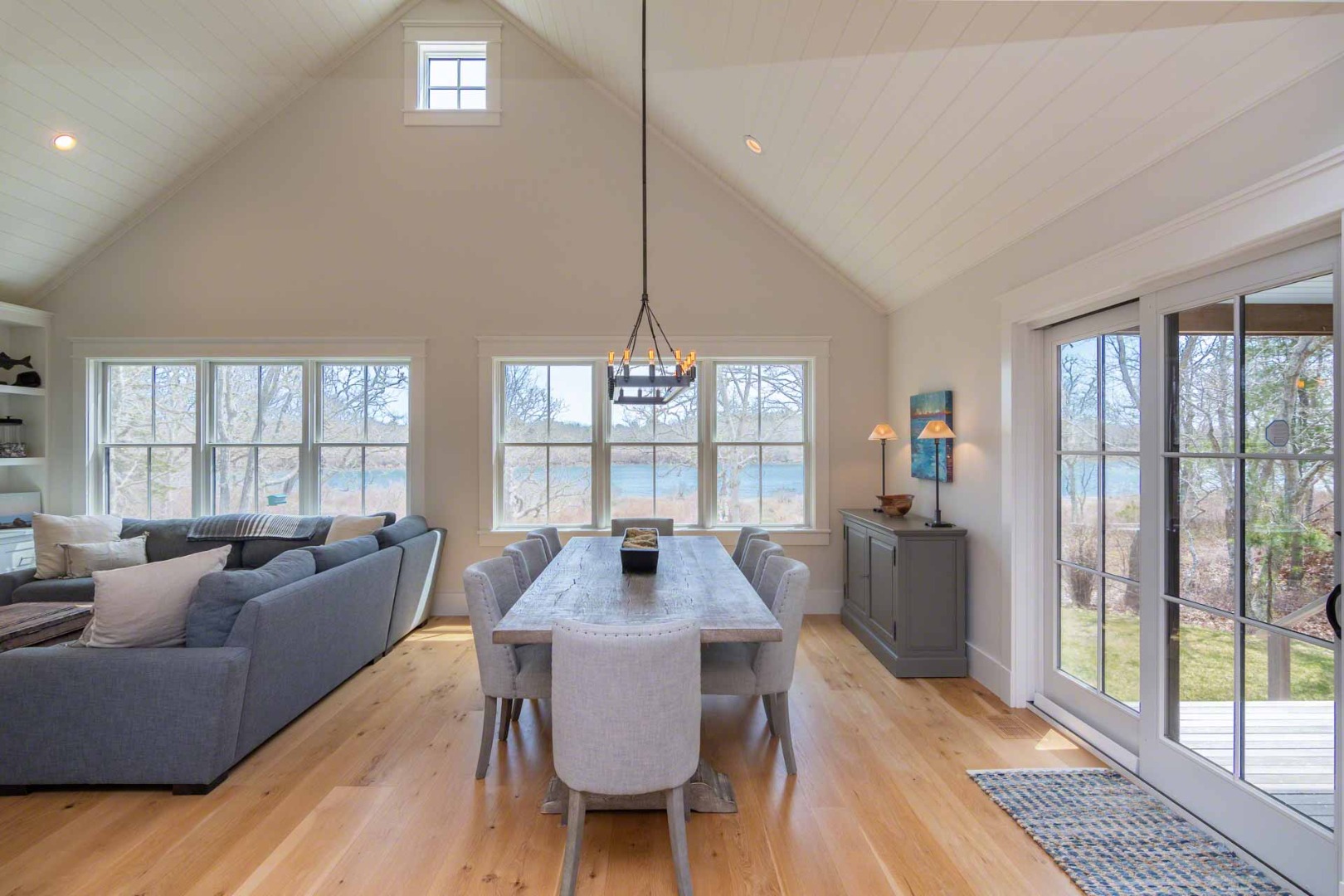 59 Seth's Way Edgartown, MA 02539 - Photo 16 of 46 a view of a dining room with furniture wooden floor and a chandelier