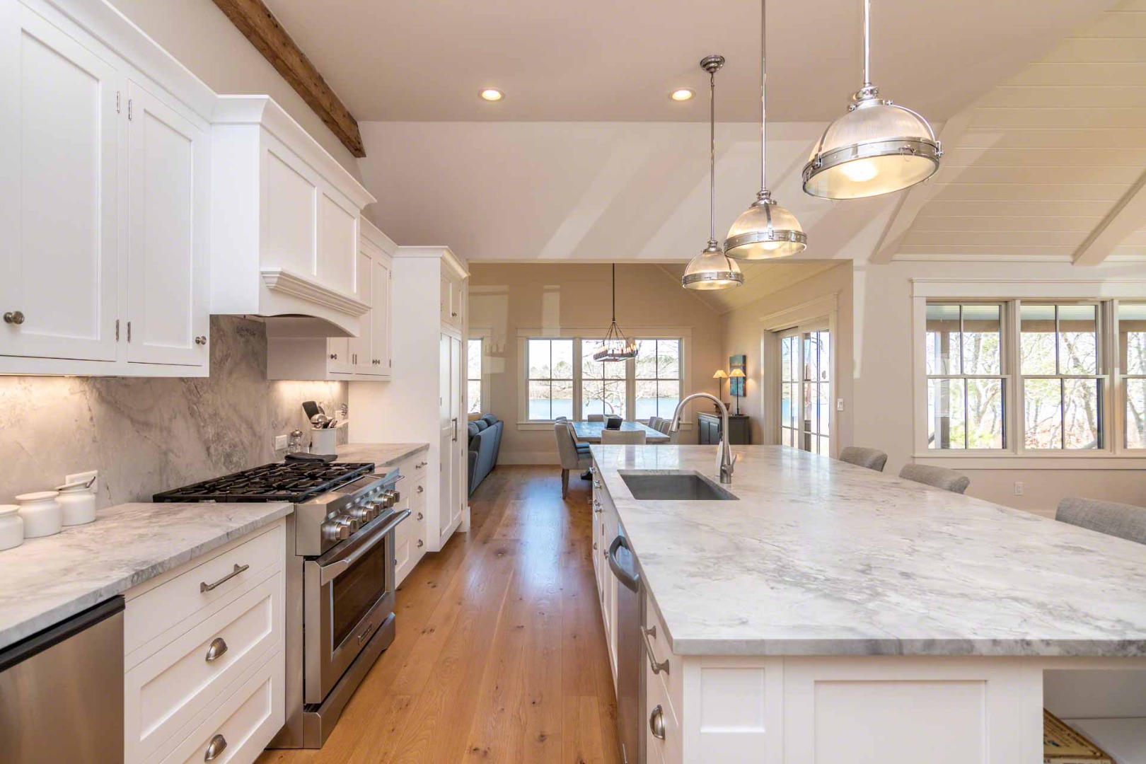 59 Seth's Way Edgartown, MA 02539 - Photo 18 of 46 a kitchen with stainless steel appliances granite countertop a stove oven and a white cabinets