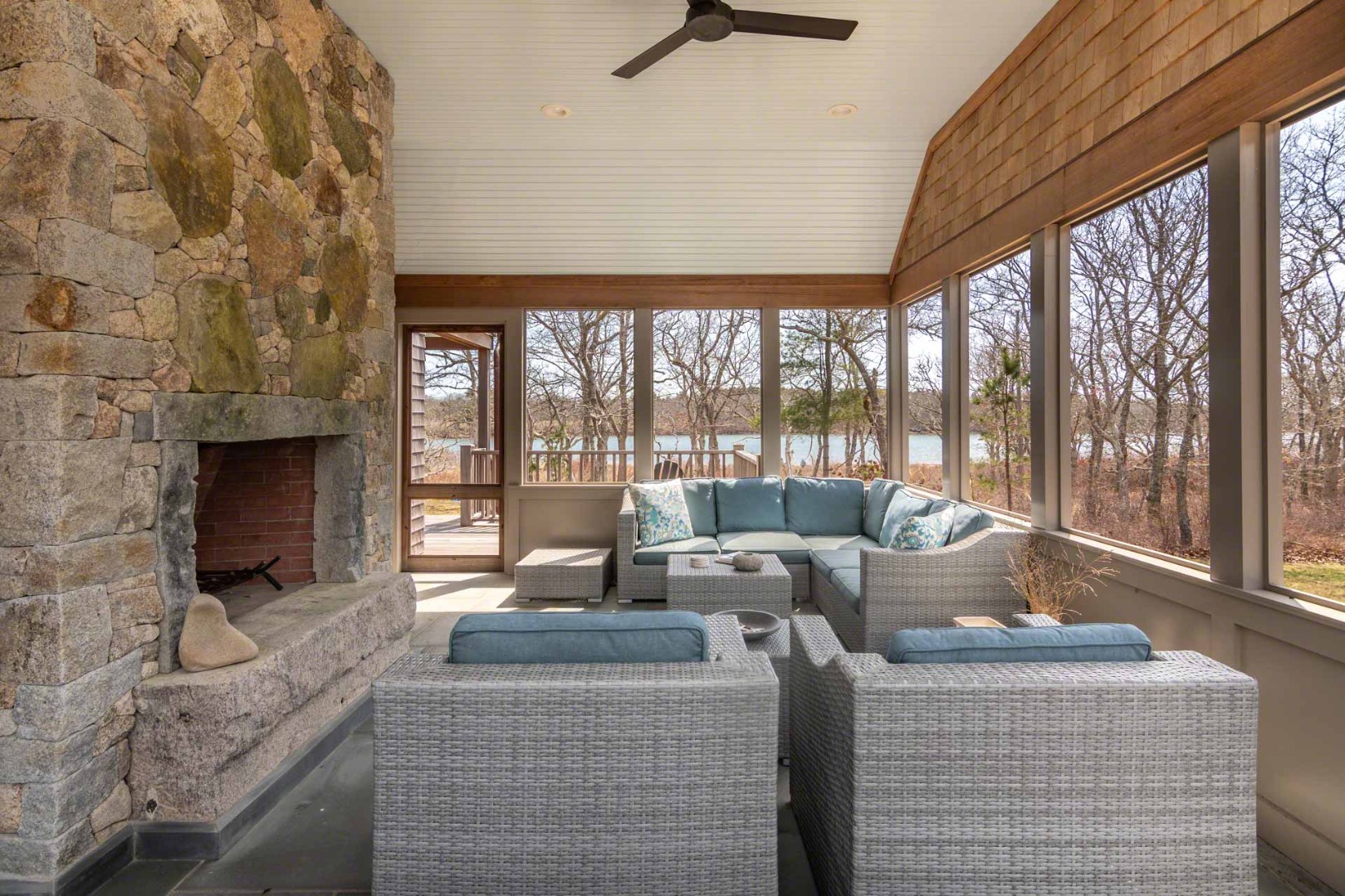 59 Seth's Way Edgartown, MA 02539 - Photo 24 of 46 a living room with fireplace furniture and a floor to ceiling window