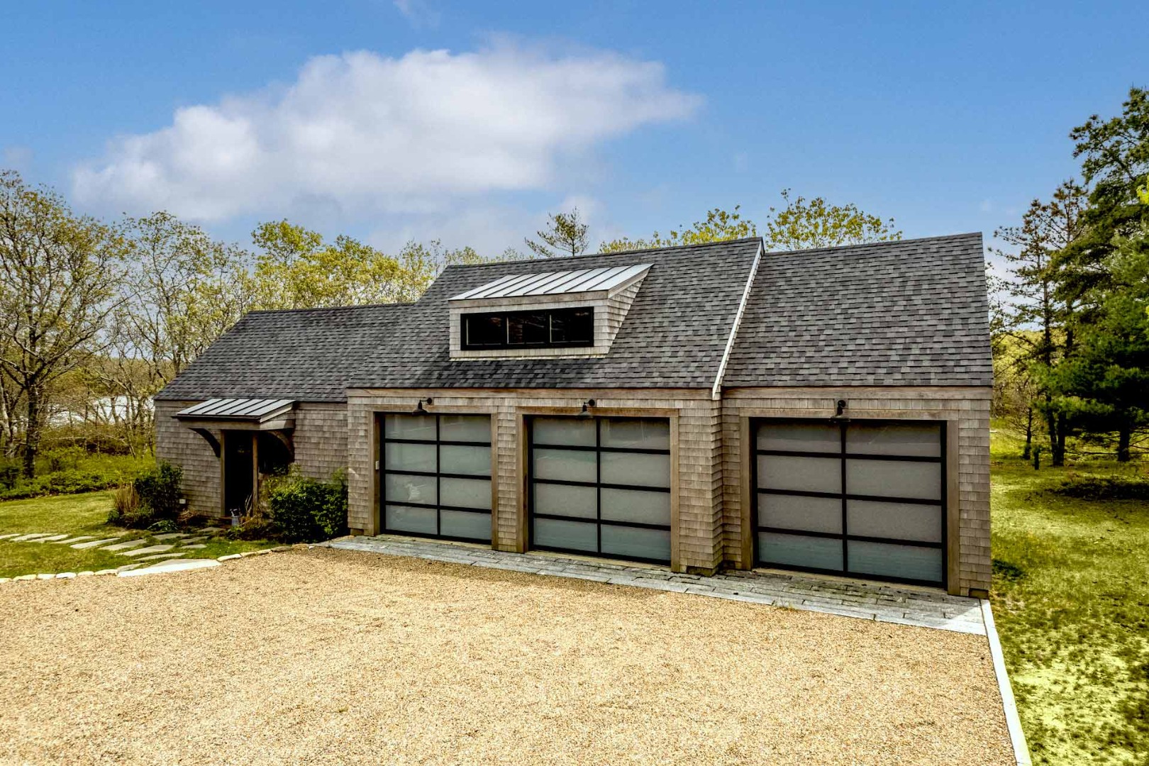 59 Seth's Way Edgartown, MA 02539 - Photo 6 of 46 front view of a house with a garage