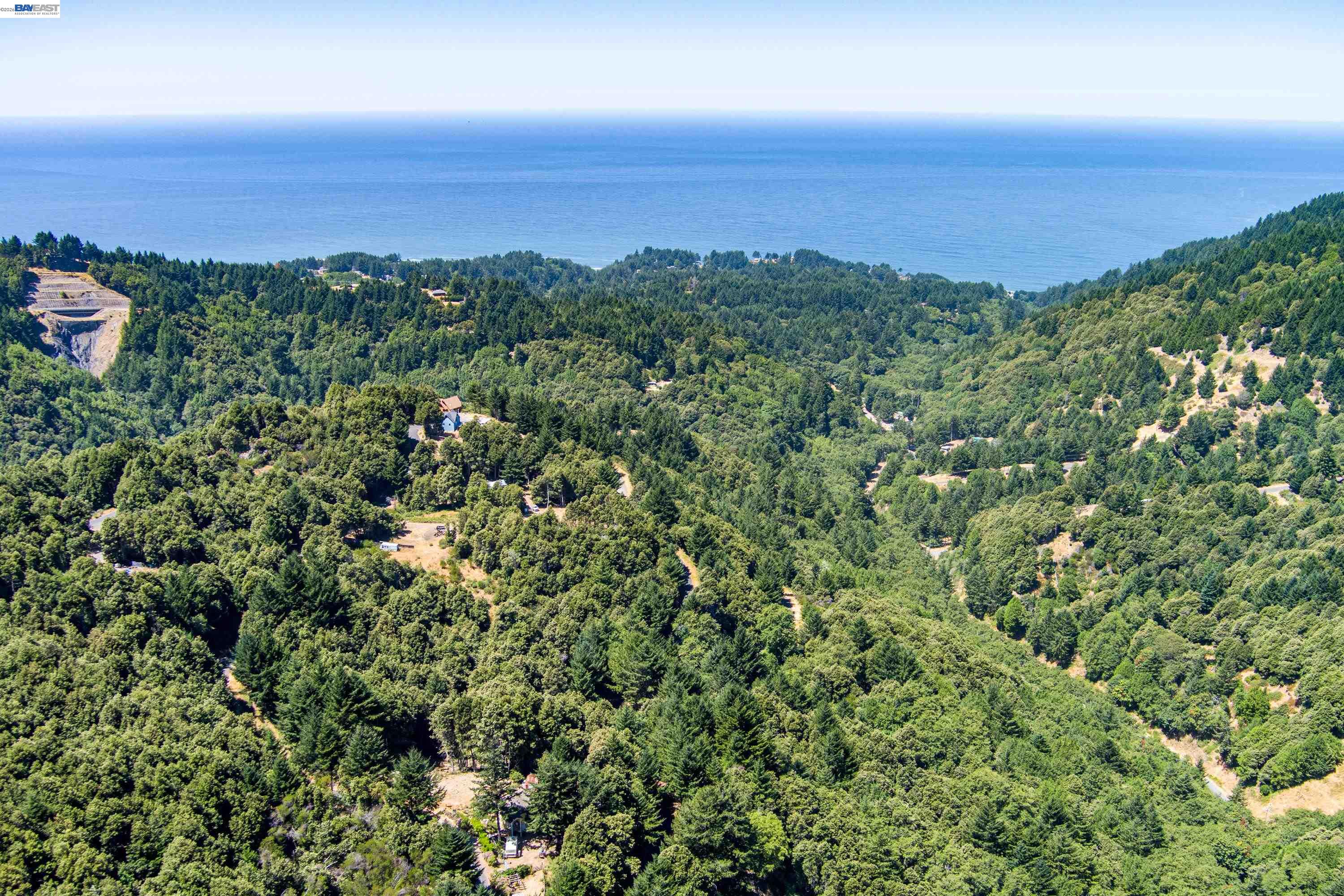an aerial view of a city and mountain