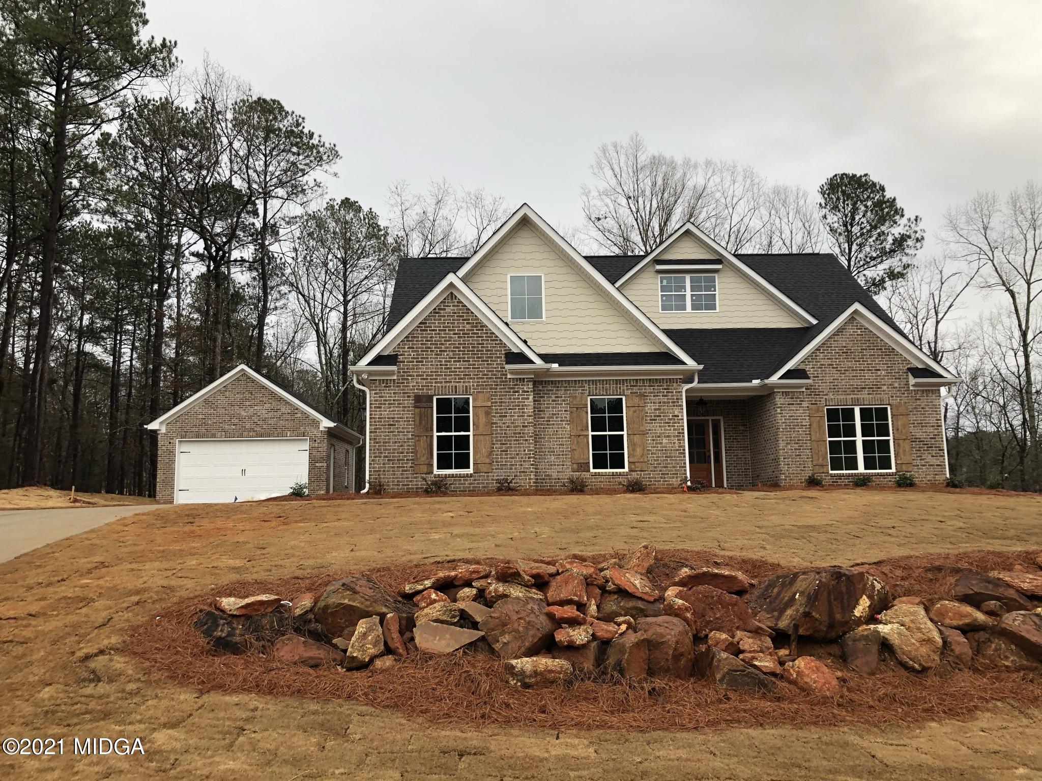 85 Adam Drive Forsyth, GA 31029 - Photo 1 of 18 a front view of a house with a yard