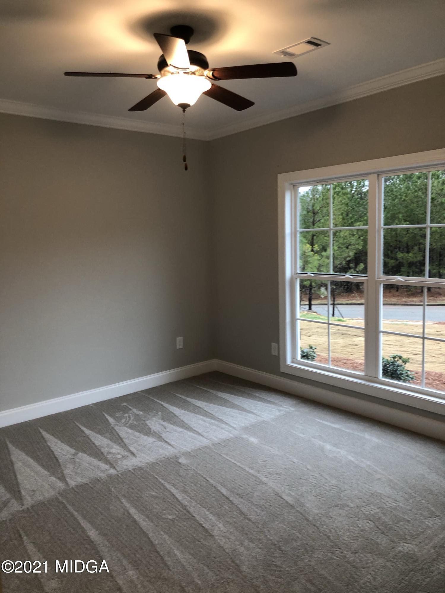 85 Adam Drive Forsyth, GA 31029 - Photo 13 of 18 a view of an empty room with a window