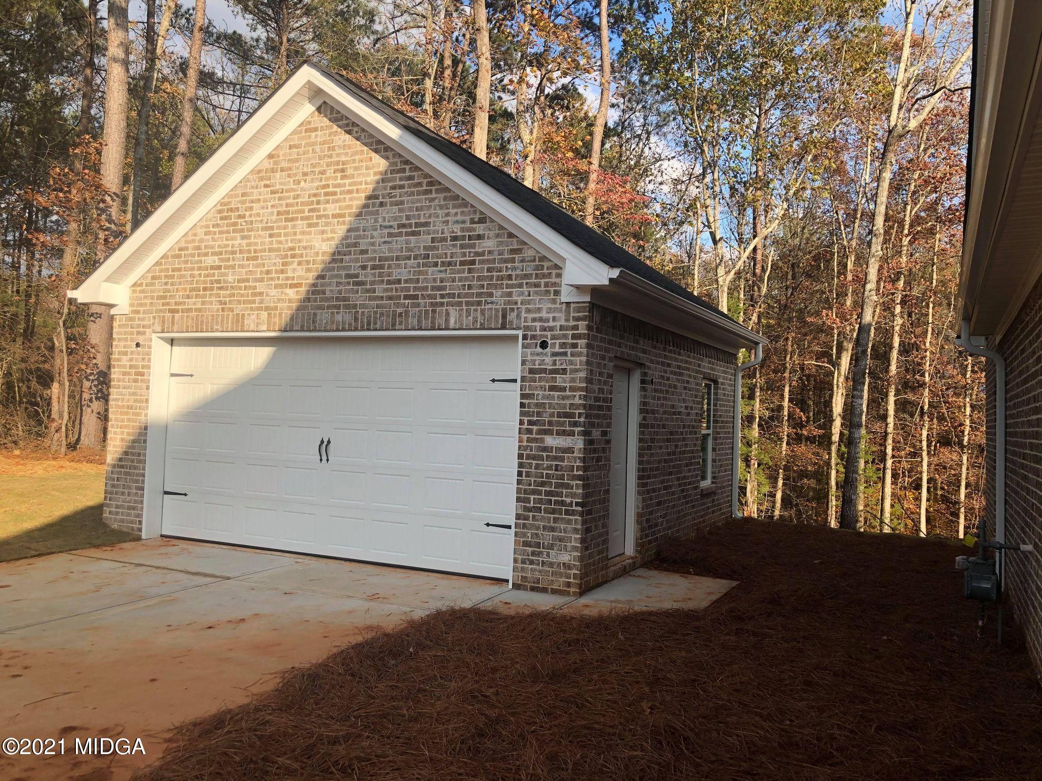 85 Adam Drive Forsyth, GA 31029 - Photo 17 of 18 a view of a house with a outdoor space