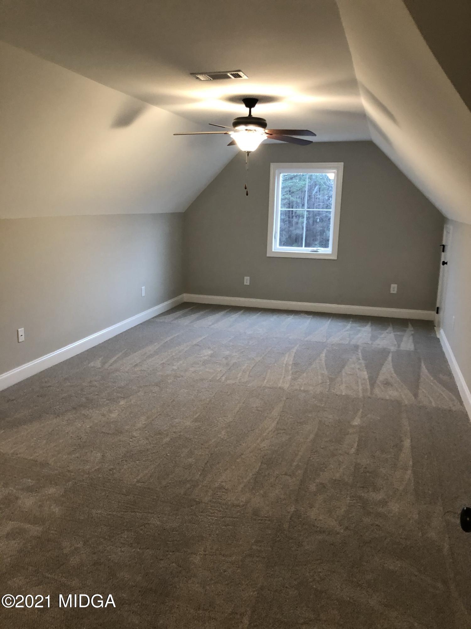 85 Adam Drive Forsyth, GA 31029 - Photo 7 of 18 en empty room with windows
