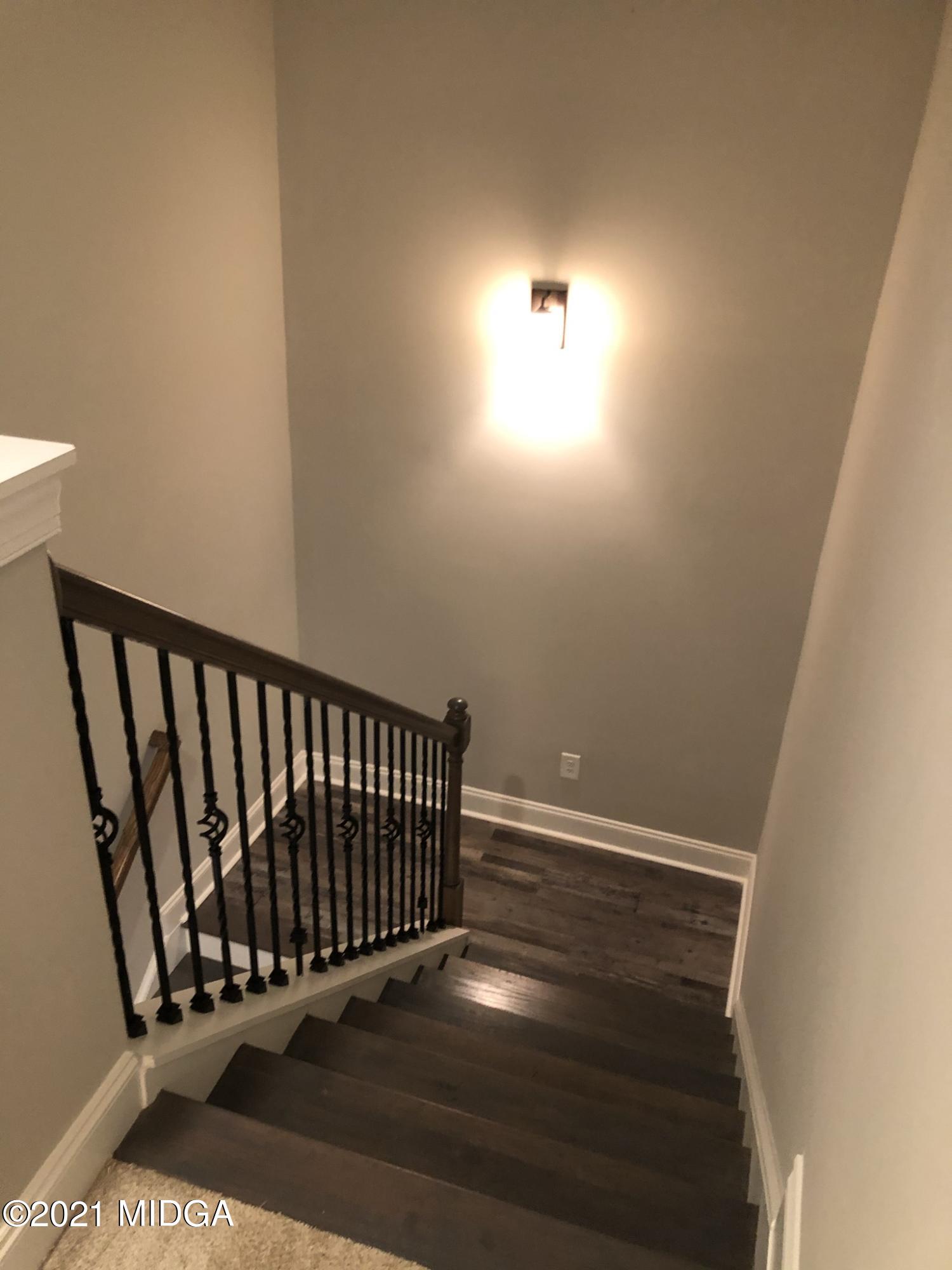 85 Adam Drive Forsyth, GA 31029 - Photo 8 of 18 a view of entryway with wooden floor
