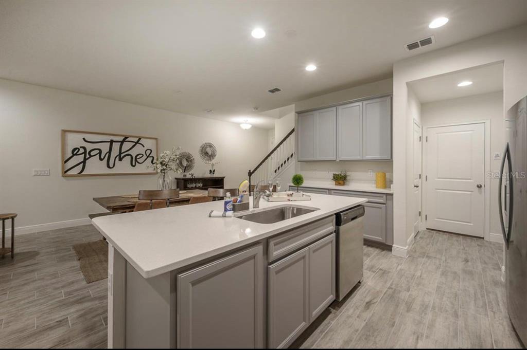 10128 Newel Valley Loop Riverview, FL 33569 - Photo 3 of 26 a kitchen with a sink appliances and cabinets
