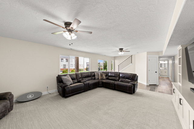 2591 East Washington Dam Road Washington, UT 84780 - Photo 39 of 67 Spacious living area featuring light carpeting and neutral wall tones