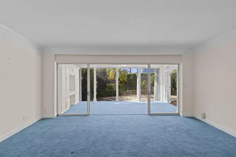 a view of an empty room with a fireplace