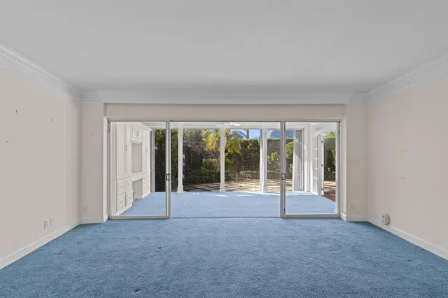 a view of an empty room with a fireplace