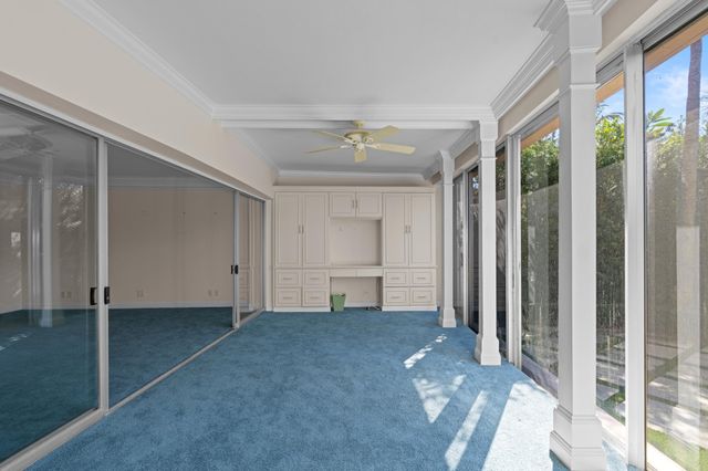 a view of empty room with a ceiling fan