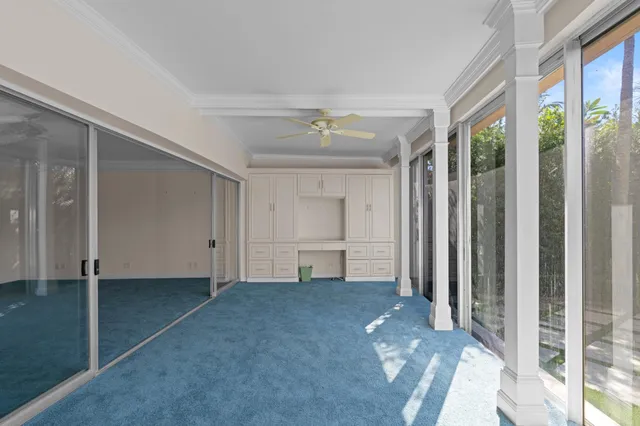 a view of empty room with a ceiling fan