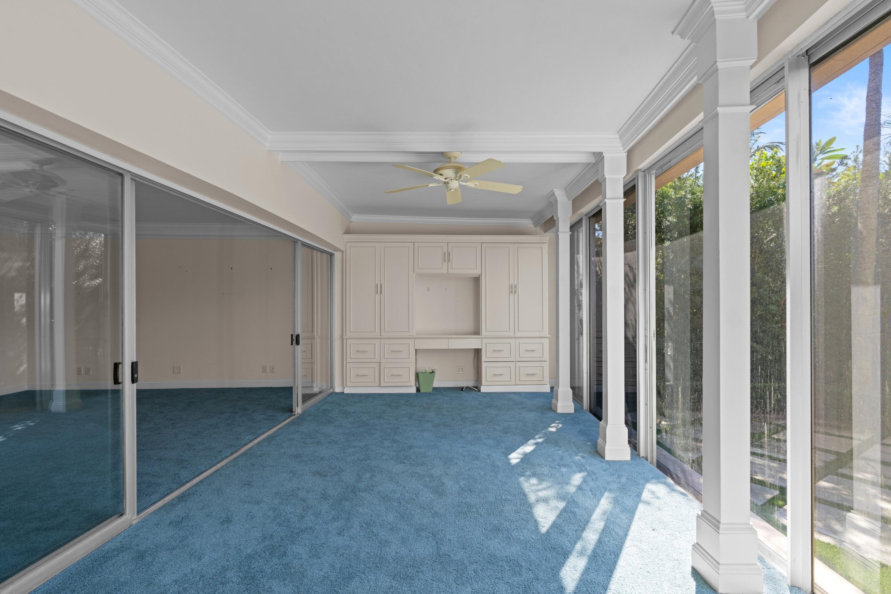 369 South Lake Drive, Unit 1D Palm Beach, FL 33480 - Photo 19 of 46 a view of empty room with a ceiling fan