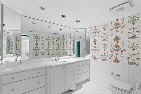 a bathroom with a double vanity sink mirror and double