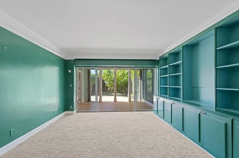 a view of an empty room with a balcony