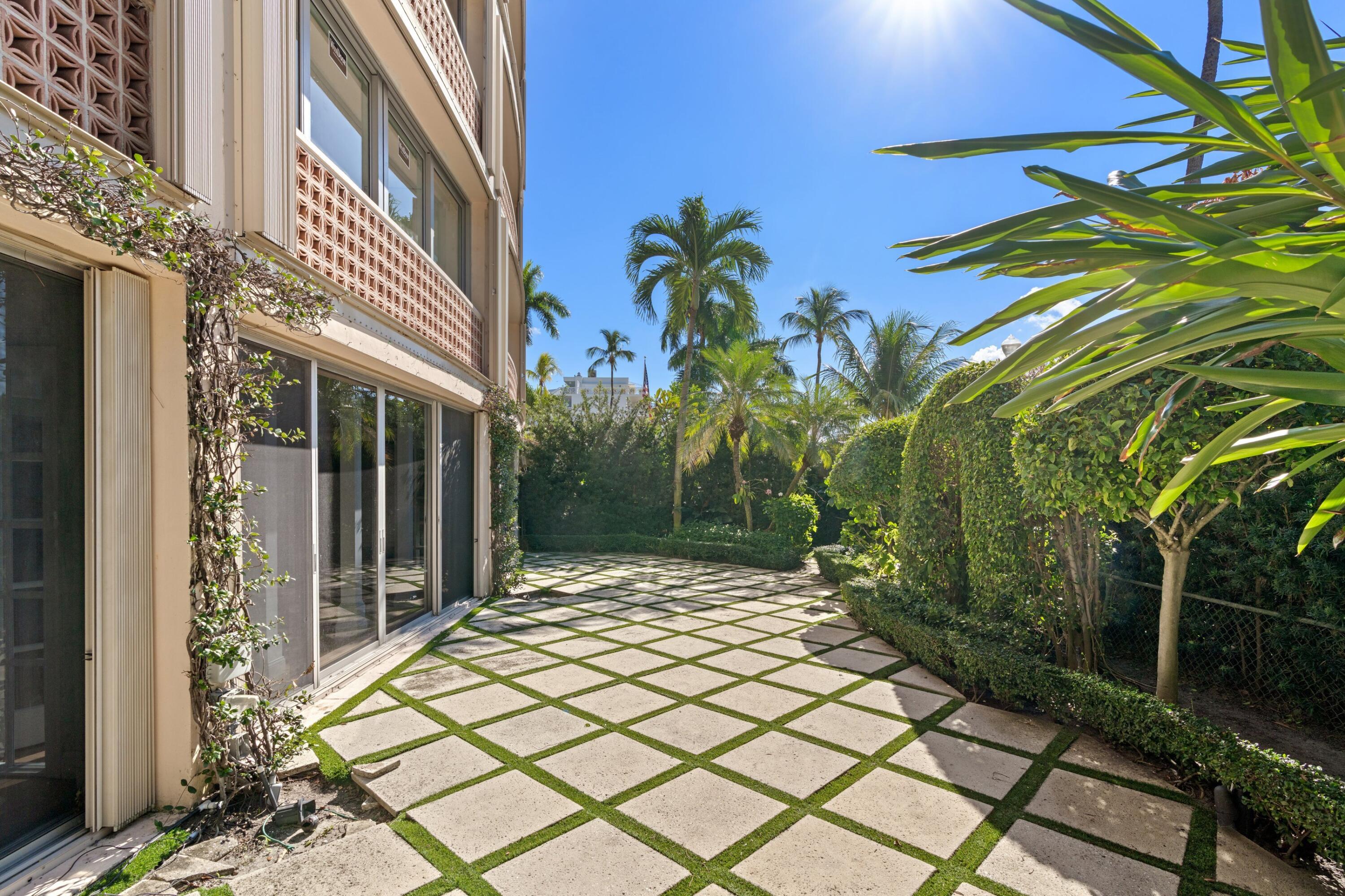 369 South Lake Drive, Unit 1D Palm Beach, FL 33480 - Photo 28 of 46 a view of a house with a yard