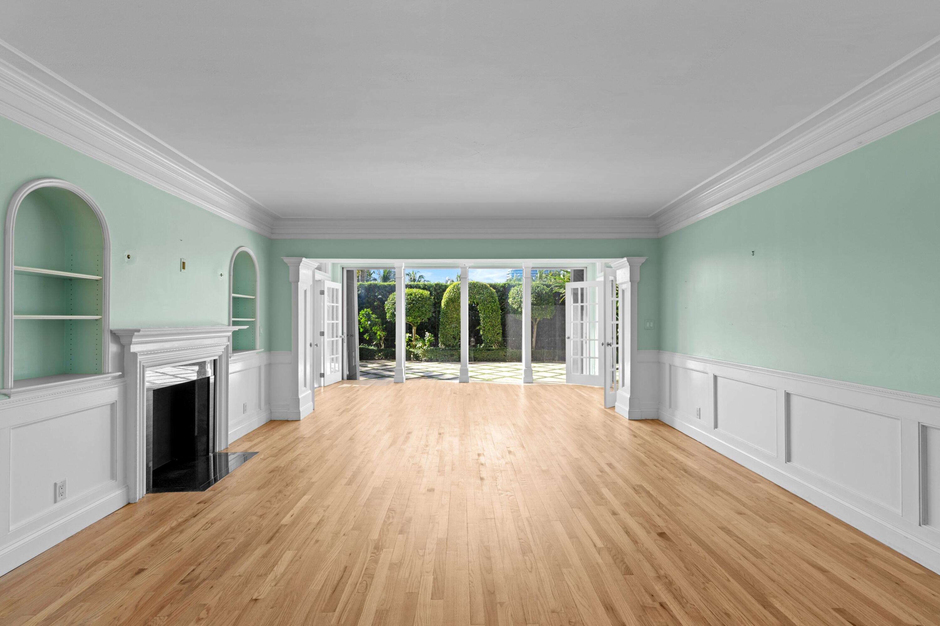 369 South Lake Drive, Unit 1D Palm Beach, FL 33480 - Photo 3 of 46 wooden floor in an empty room with a fireplace