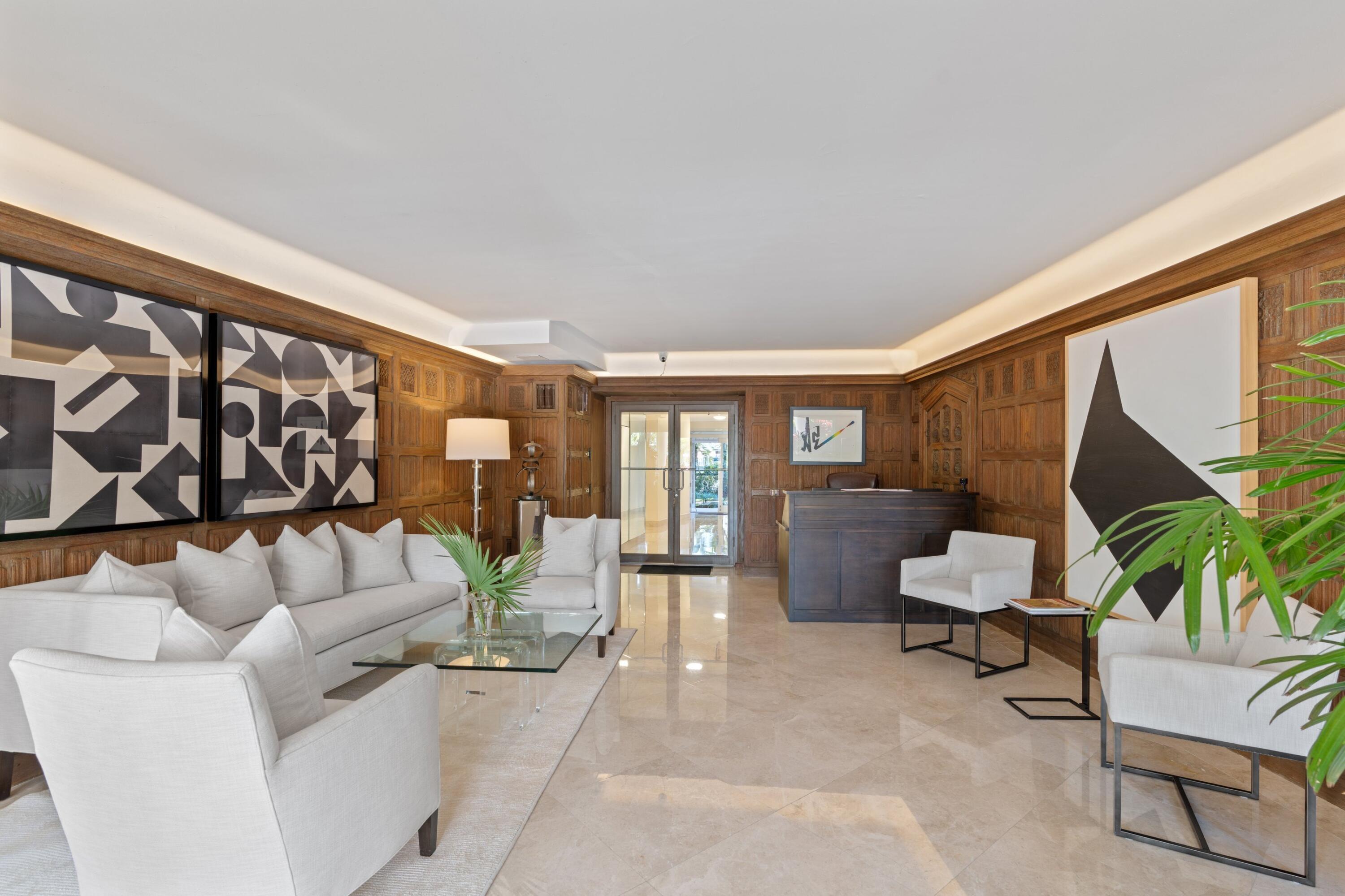 369 South Lake Drive, Unit 1D Palm Beach, FL 33480 - Photo 31 of 46 a living room with furniture and a large window