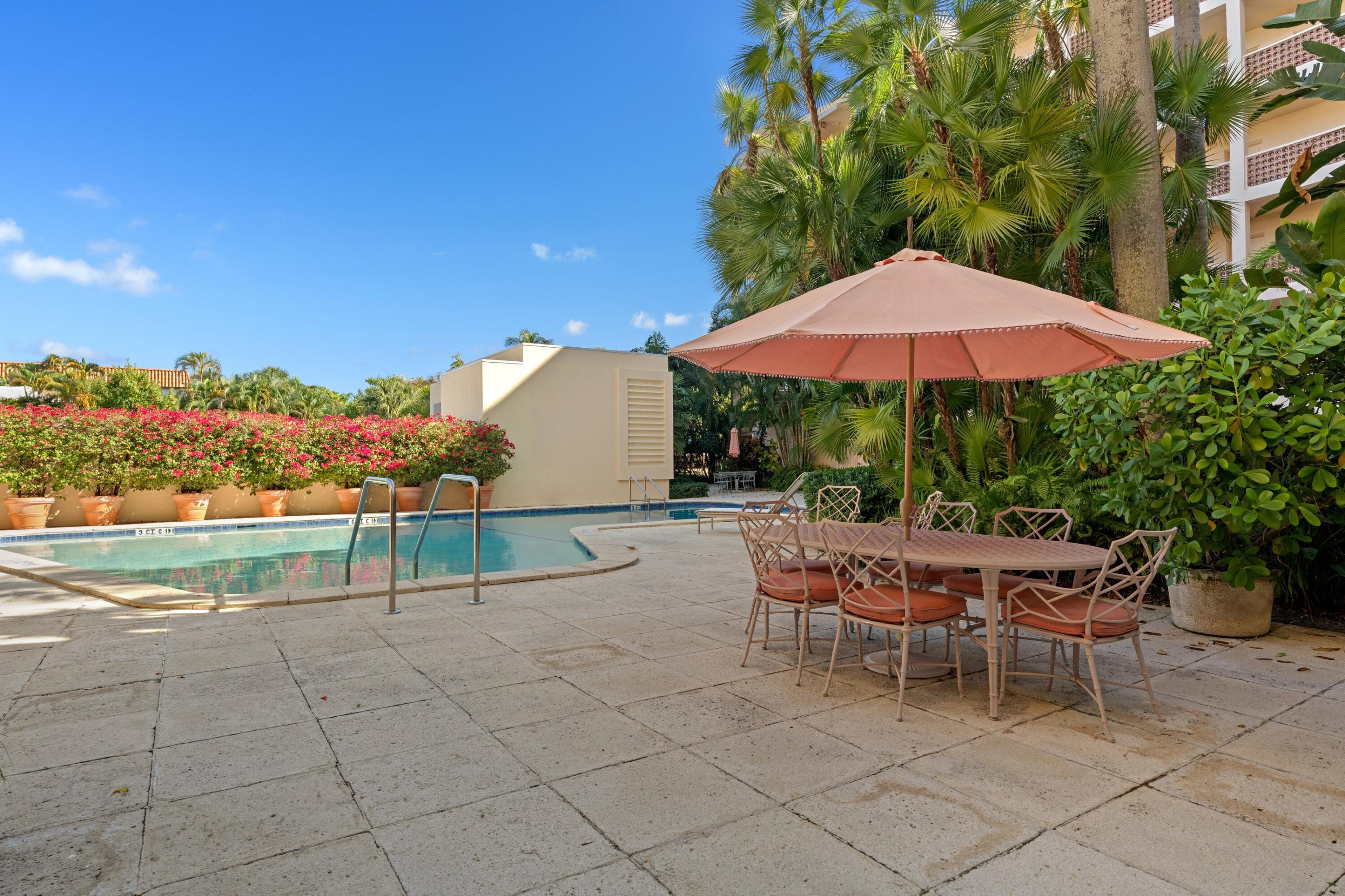 369 South Lake Drive, Unit 1D Palm Beach, FL 33480 - Photo 33 of 46 a patio with a patio table and chairs