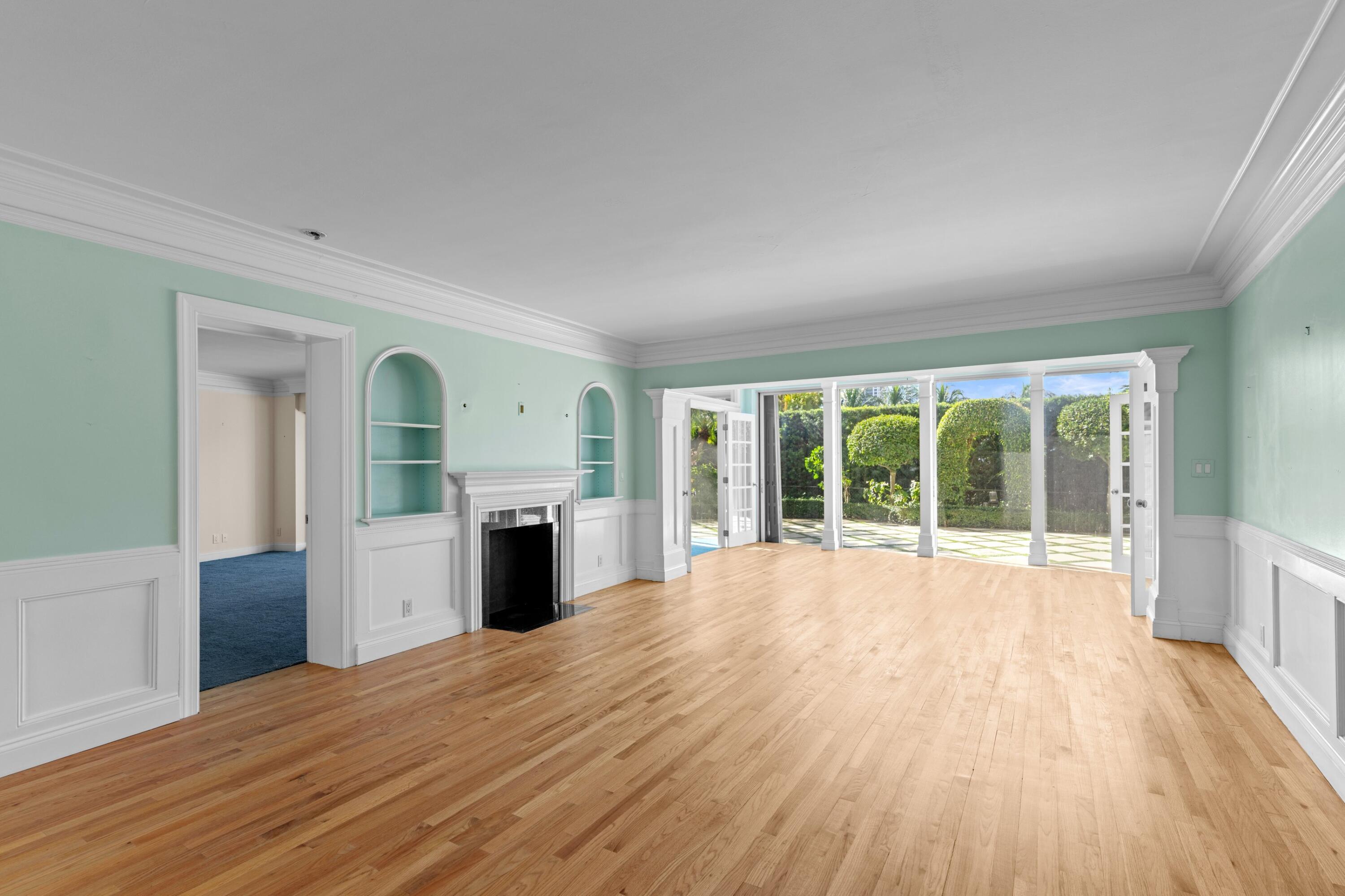 369 South Lake Drive, Unit 1D Palm Beach, FL 33480 - Photo 4 of 46 a view of an empty room with wooden floor and a window