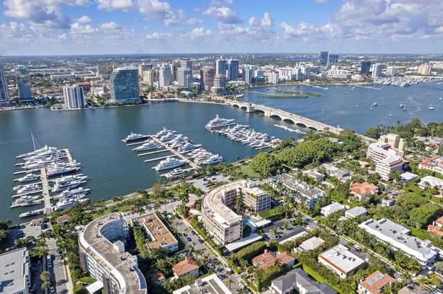 an aerial view of a residential building and lake view
