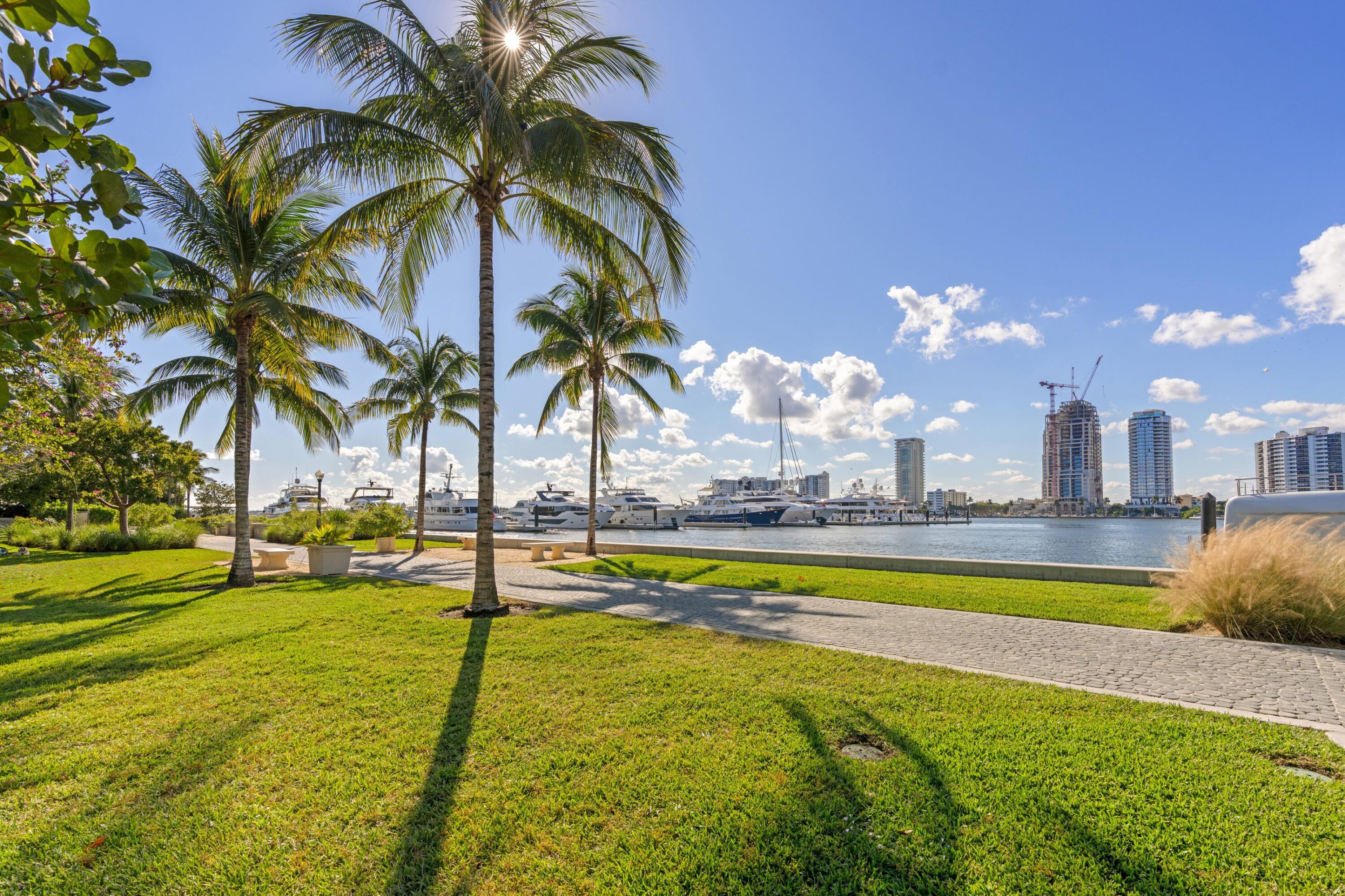 369 South Lake Drive, Unit 1D Palm Beach, FL 33480 - Photo 43 of 46 a view of a swimming pool with a table and chairs