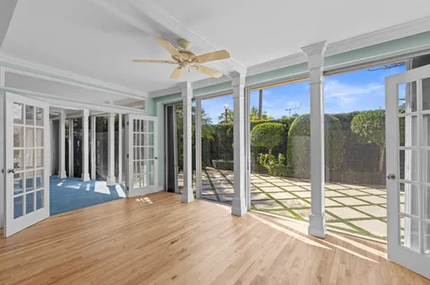 a view of livingroom with furniture wooden floor and floor to ceiling window