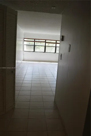 a view of empty room with windows