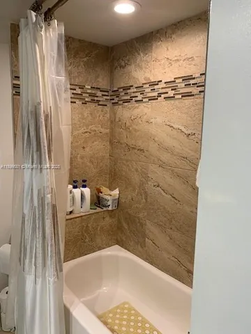 a bathroom with a bath tub