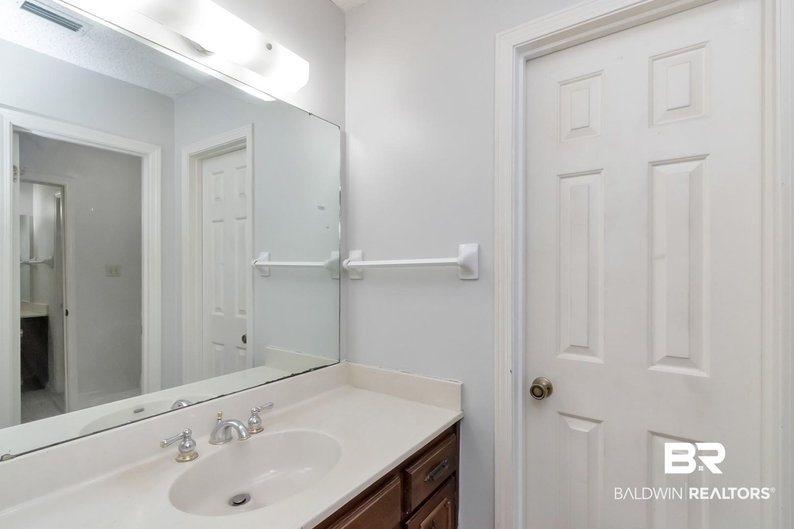 1229 West Chimney Top Drive Mobile, AL 36695 - Photo 20 of 36 One side of Primary Bath Suite- Primary bath has separate his/her vanity areas. Each with it's own walk in closet. Tub/shower/toilet is in between. Great set up!