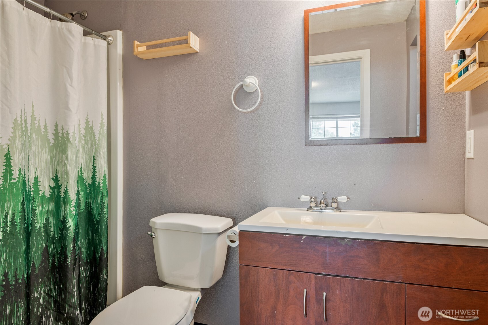 642 5th Avenue Southwest Castle Rock, WA 98611 - Photo 16 of 33 a bathroom with a sink mirror and toilet