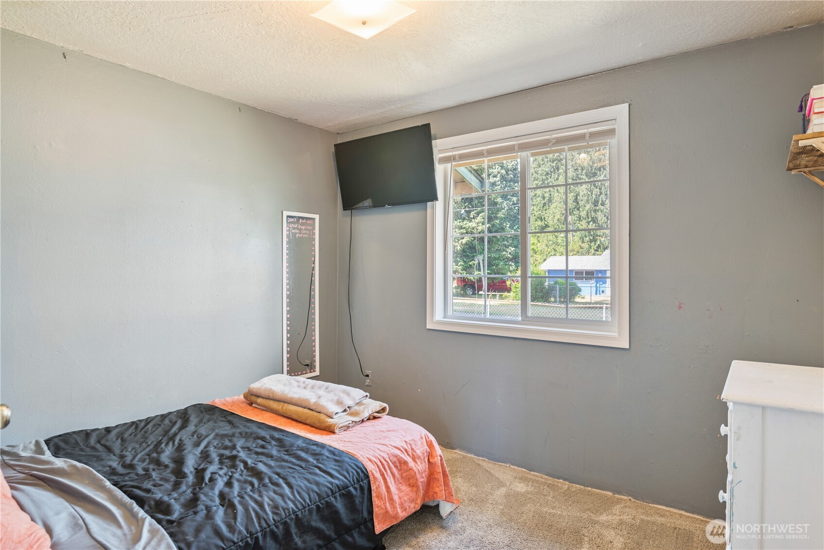 642 5th Avenue Southwest Castle Rock, WA 98611 - Photo 18 of 33 a bedroom with a bed and a window