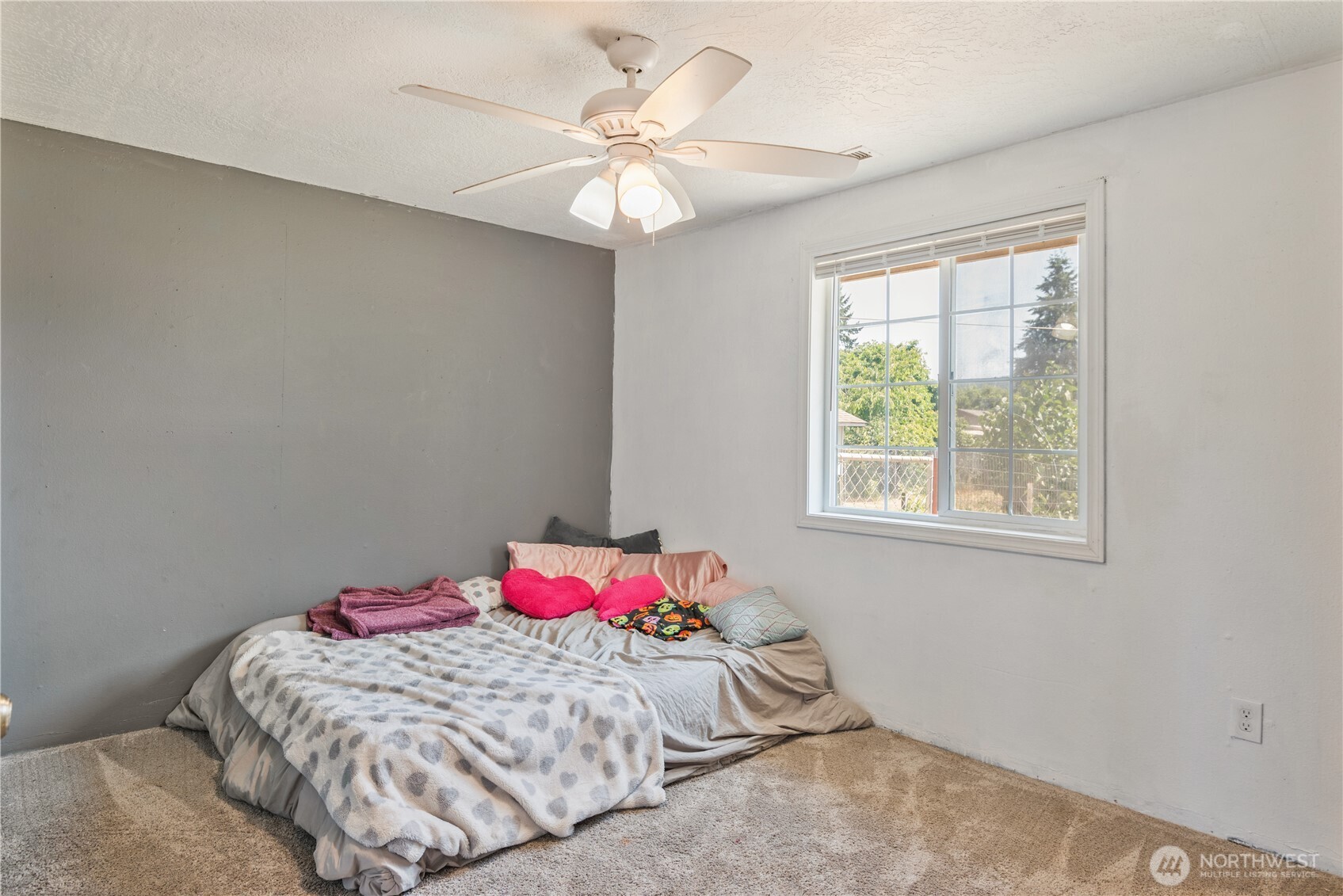 642 5th Avenue Southwest Castle Rock, WA 98611 - Photo 20 of 33 a bedroom with a bed and a chandelier
