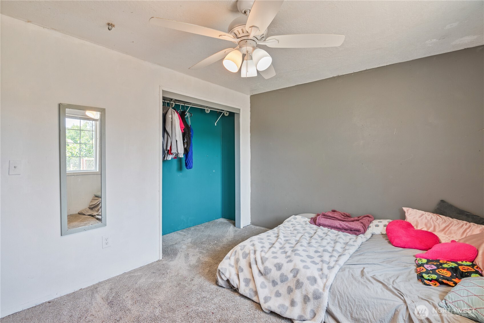 642 5th Avenue Southwest Castle Rock, WA 98611 - Photo 21 of 33 a bedroom with a bed and a chandelier