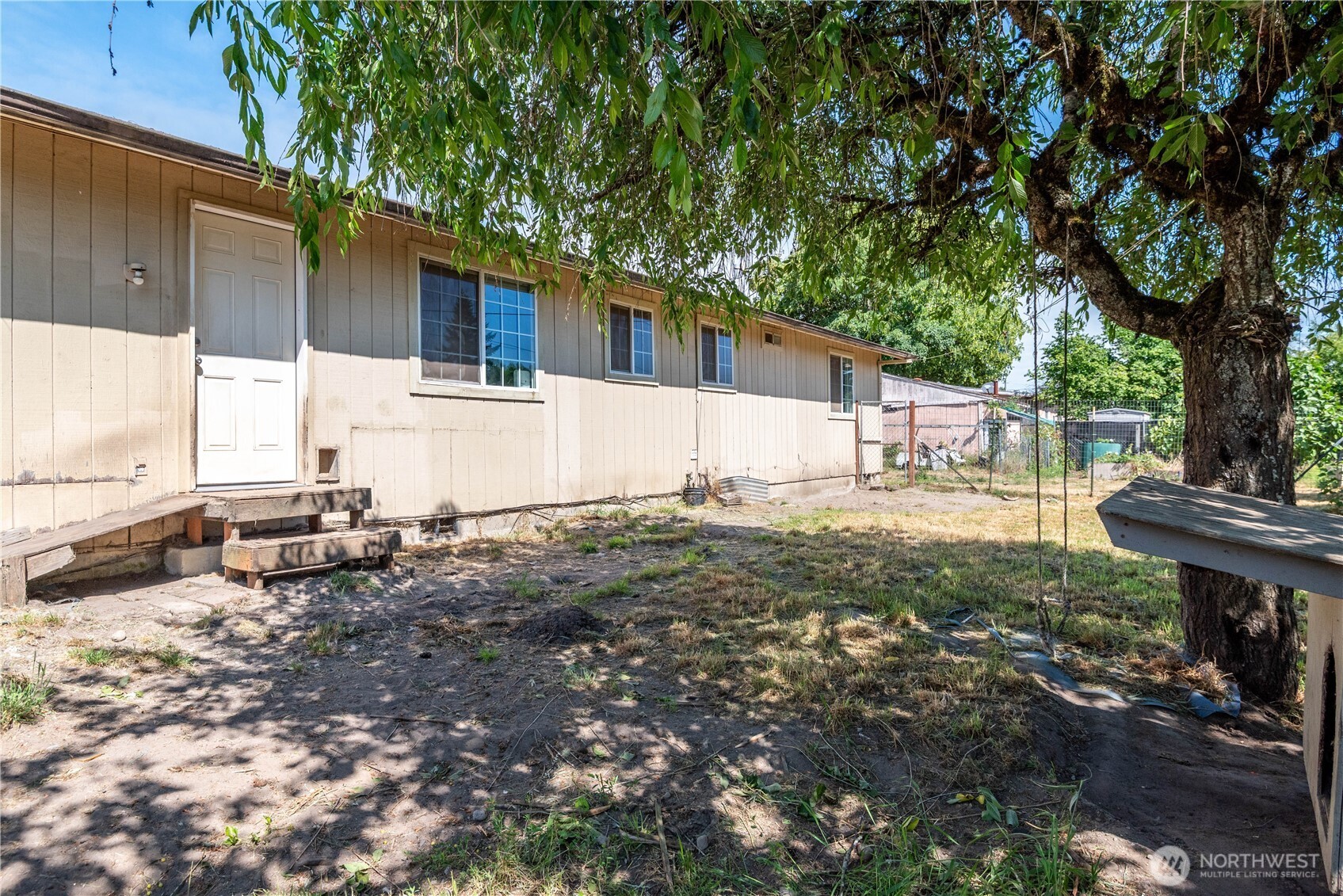 642 5th Avenue Southwest Castle Rock, WA 98611 - Photo 26 of 33 a view of a house with backyard and sitting area