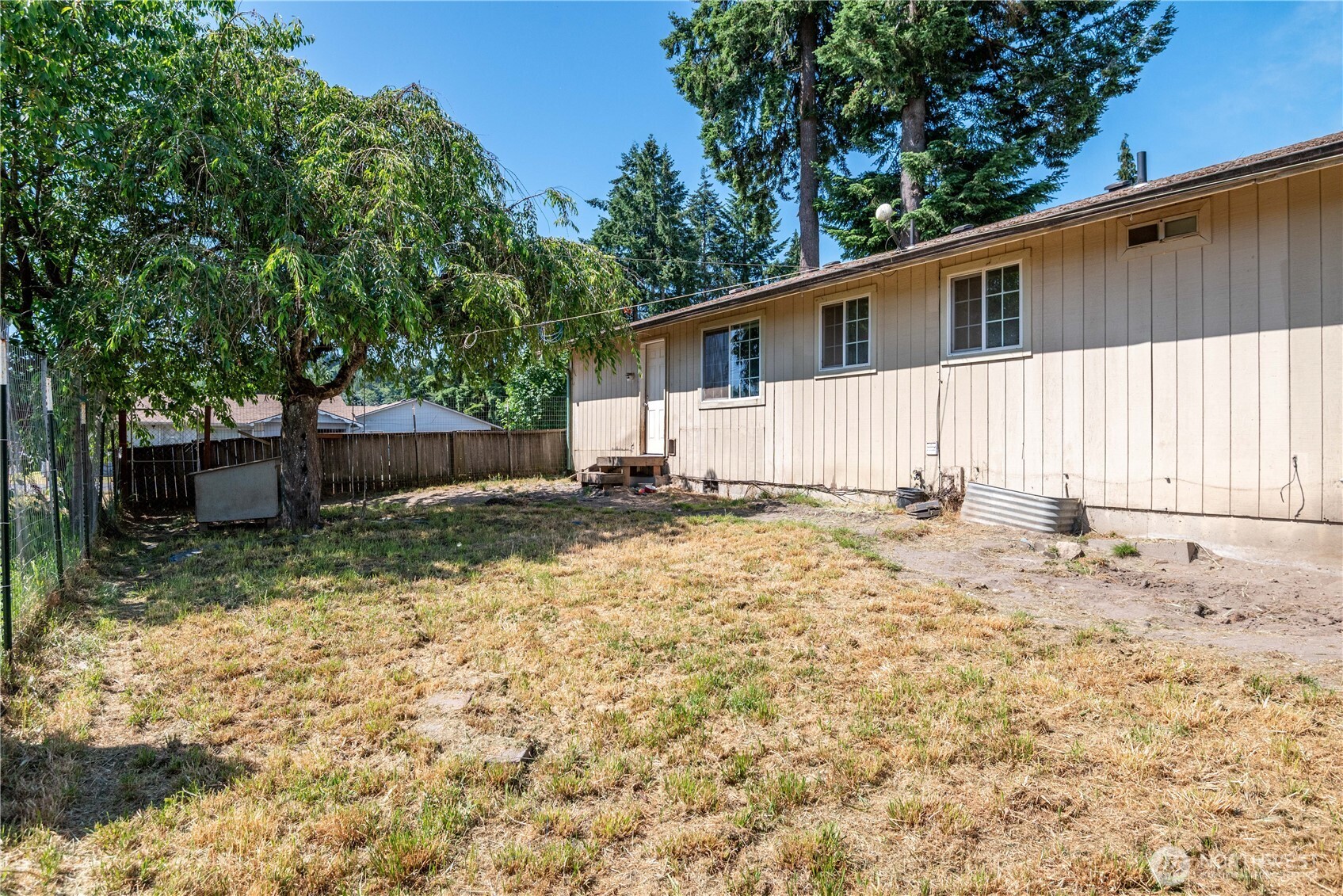 642 5th Avenue Southwest Castle Rock, WA 98611 - Photo 28 of 33 a view of a house with a yard