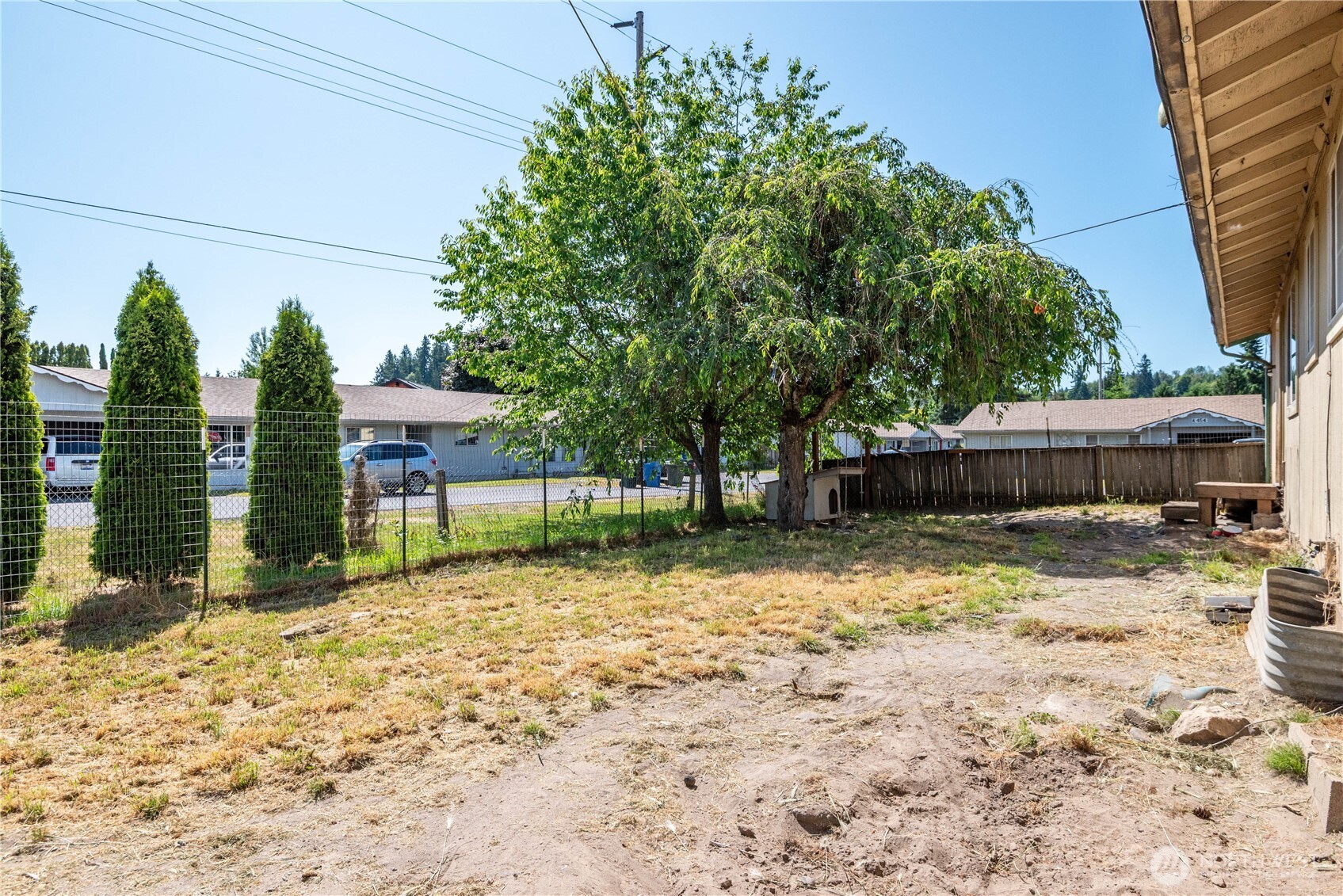642 5th Avenue Southwest Castle Rock, WA 98611 - Photo 29 of 33 a backyard of a house with barbeque oven and outdoor seating